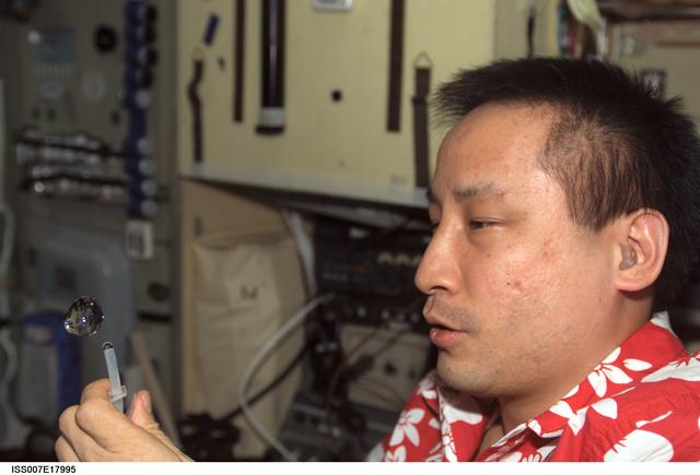 NASA image: Lu plays with a droplet of liquid