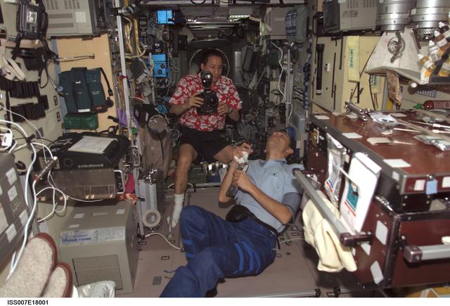 NASA image: Lu  and Duque play with a droplet of liquid