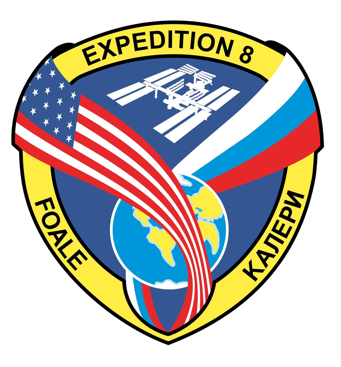 ISS008-S-001 (August 2003) --- This emblem represents the eighth long-duration expedition to the International Space Station. The banner encircling the Earth, as a stylized figure 8, combines the flags of the partner nations represented by the crew. The International Space Station is portrayed above the Earth in its assembly complete configuration. The names of the two crewmembers, Michael Foale and Alexander Kaleri, are depicted in the border.    The NASA insignia design for station space flights is reserved for use by the crewmembers and other official use as the NASA Administrator may authorize. Public availability has been approved only in the form of illustrations by the various news media. When and if there is any change in this policy, which is not anticipated, such will be publicly announced.