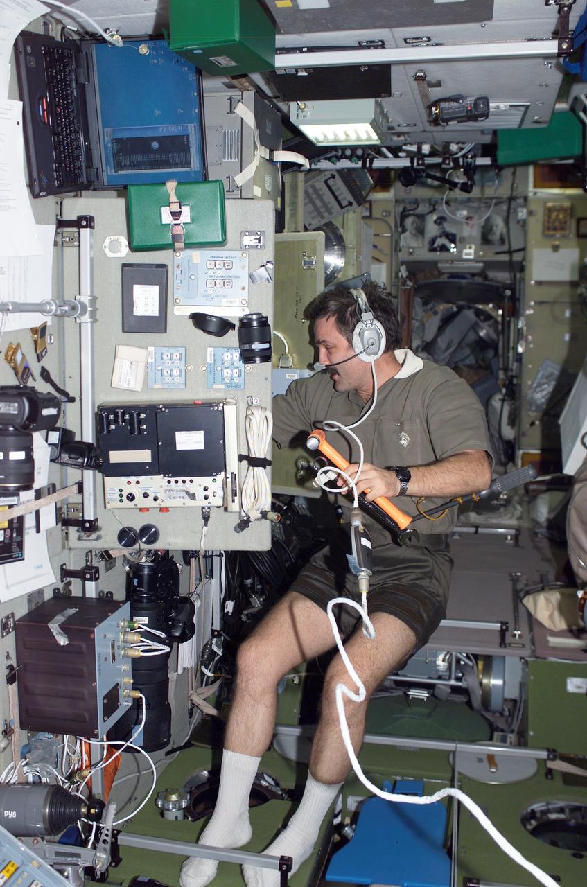 ISS008-E-12269 (9 January 2004) --- Cosmonaut Alexander Y. Kaleri, Expedition 8 flight engineer, uses a communication system as he works in the Zvezda Service Module on the International Space Station (ISS). Kaleri represents Rosaviakosmos.