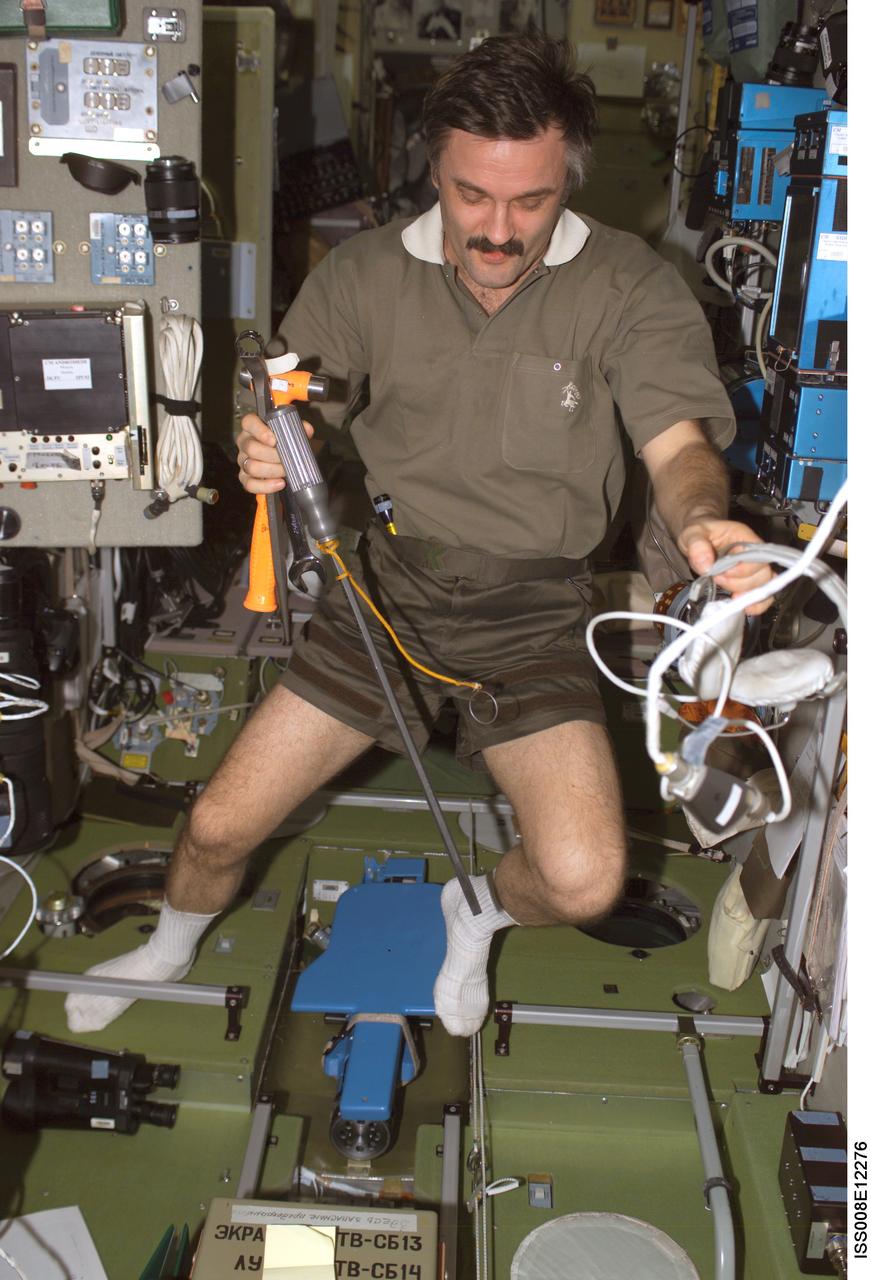 ISS008-E-12276 (9 January 2004) --- Cosmonaut Alexander Y. Kaleri, Expedition 8 flight engineer, is pictured in the Zvezda Service Module on the International Space Station (ISS). Kaleri represents Rosaviakosmos.