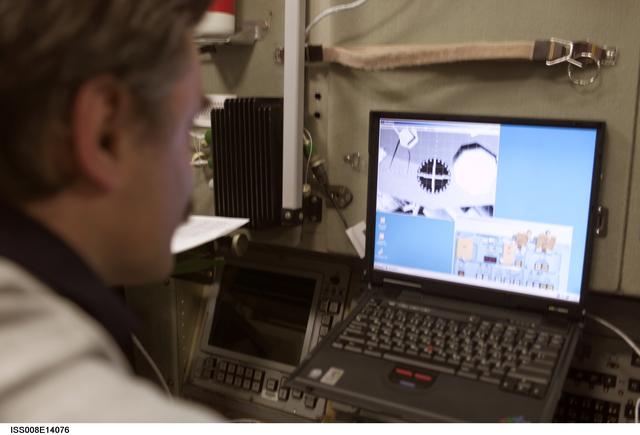 NASA image: Kaleri works with the TORU teleoperated control system in the SM during Expedition 8