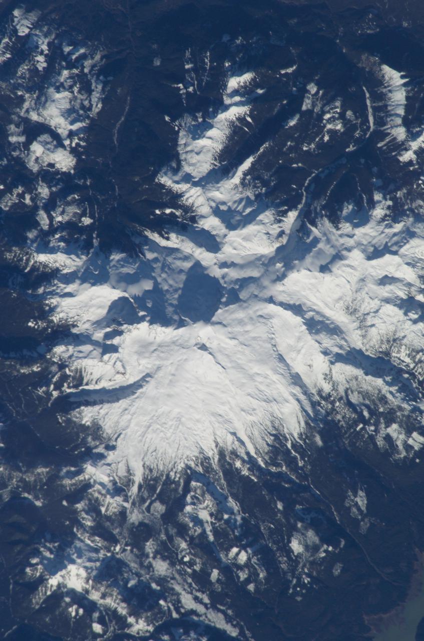 ISS008-E-15491 (12 February 2004) --- This scene featuring Mount Baker, Washington, was photographed by an Expedition 8 crewmember on the International Space Station (ISS). The high-resolution image provides details of the rough terrain near the summit and on the upper flanks. The Cascade Range is an arc of volcanoes that extends from southwestern British Columbia to northern California. One of the six major composite volcanoes is Mount Baker in northern Washington close to the Canadian border, about 85 miles north-northeast of Seattle and 65 miles southeast of Vancouver, British Columbia.