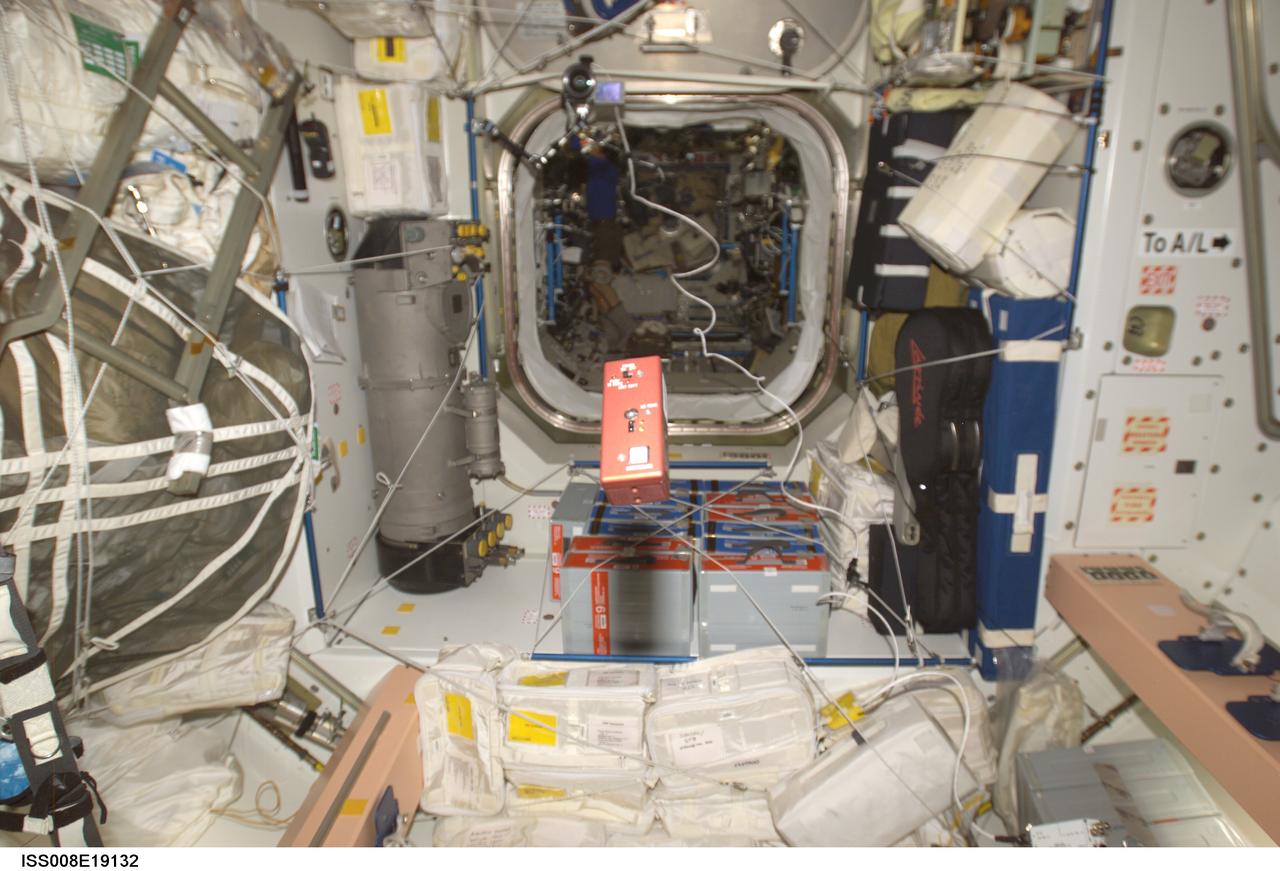 ISS008-E-19132 (24 March 2004) --- The Synchronized Position Hold, Engage, Reorient, Experimental Satellites (SPHERES) Beacon / Beacon Tester floats in the Unity node of the International Space Station.