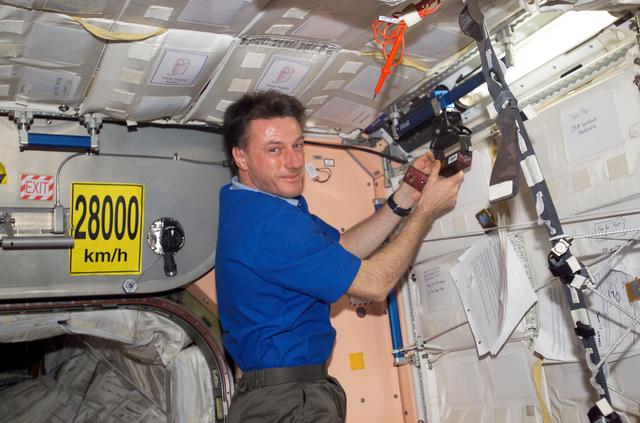 NASA image: Foale works with the SPHERES Beacon / Beacon Tester in Node 1 during Expedition 8