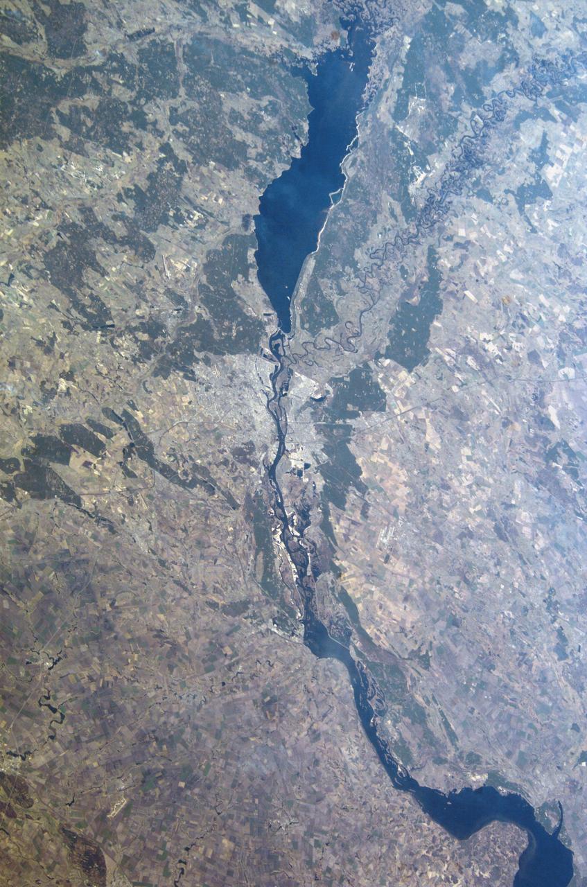 ISS008-E-20656 (4 April 2004) --- This image featuring the Ukrainian city of Kiev on a reservoir on the Dnepr River was taken by an Expedition 8 crewmember on the International Space Station (ISS). Kiev is the capital of Ukraine and home to nearly three million people and rich in the history of western civilization.