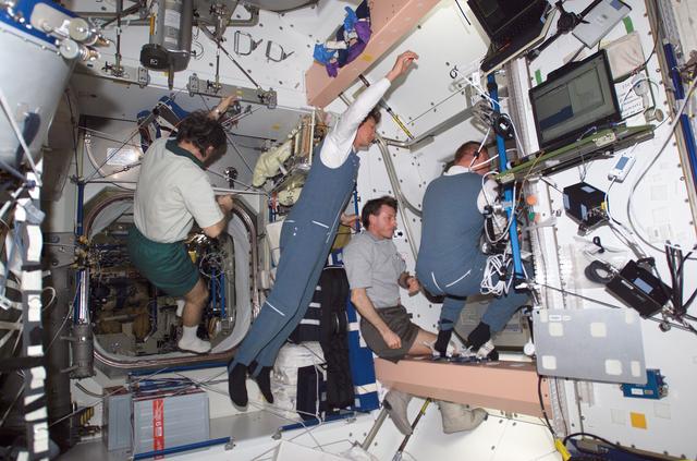 NASA image: Expedition 8 and 9 crewmembers close hatch from Node 1 to the A/L
