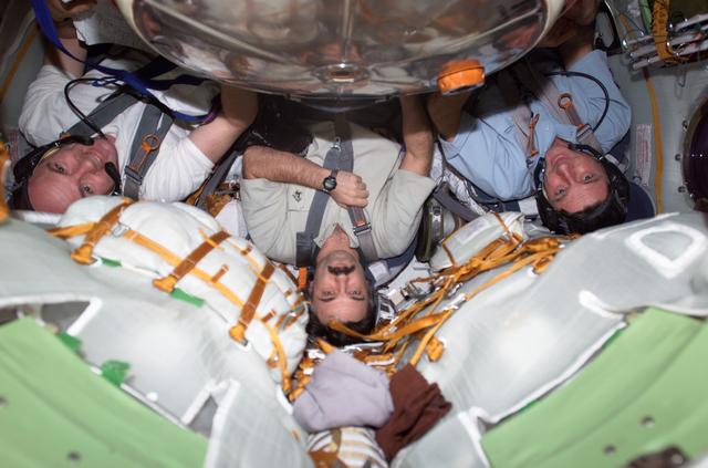 NASA image: Foale, Kaleri and Kuipers during descent training exercise in the Soyuz module at conclusion of Expedition 8