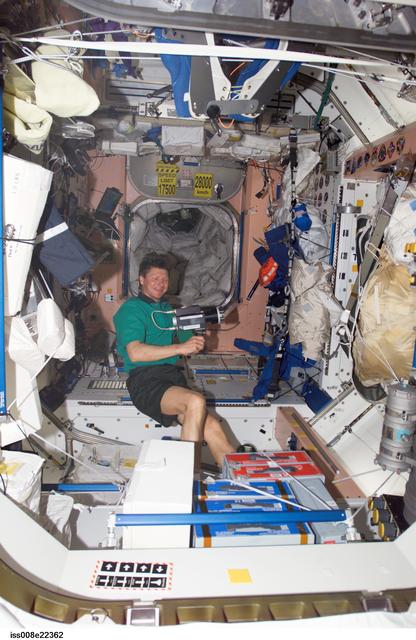 NASA image: Padalka collects air samples in the SM during Expedition 9 / Expedition 8