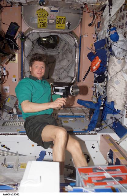 NASA image: Padalka collects air samples in the SM during Expedition 9 / Expedition 8