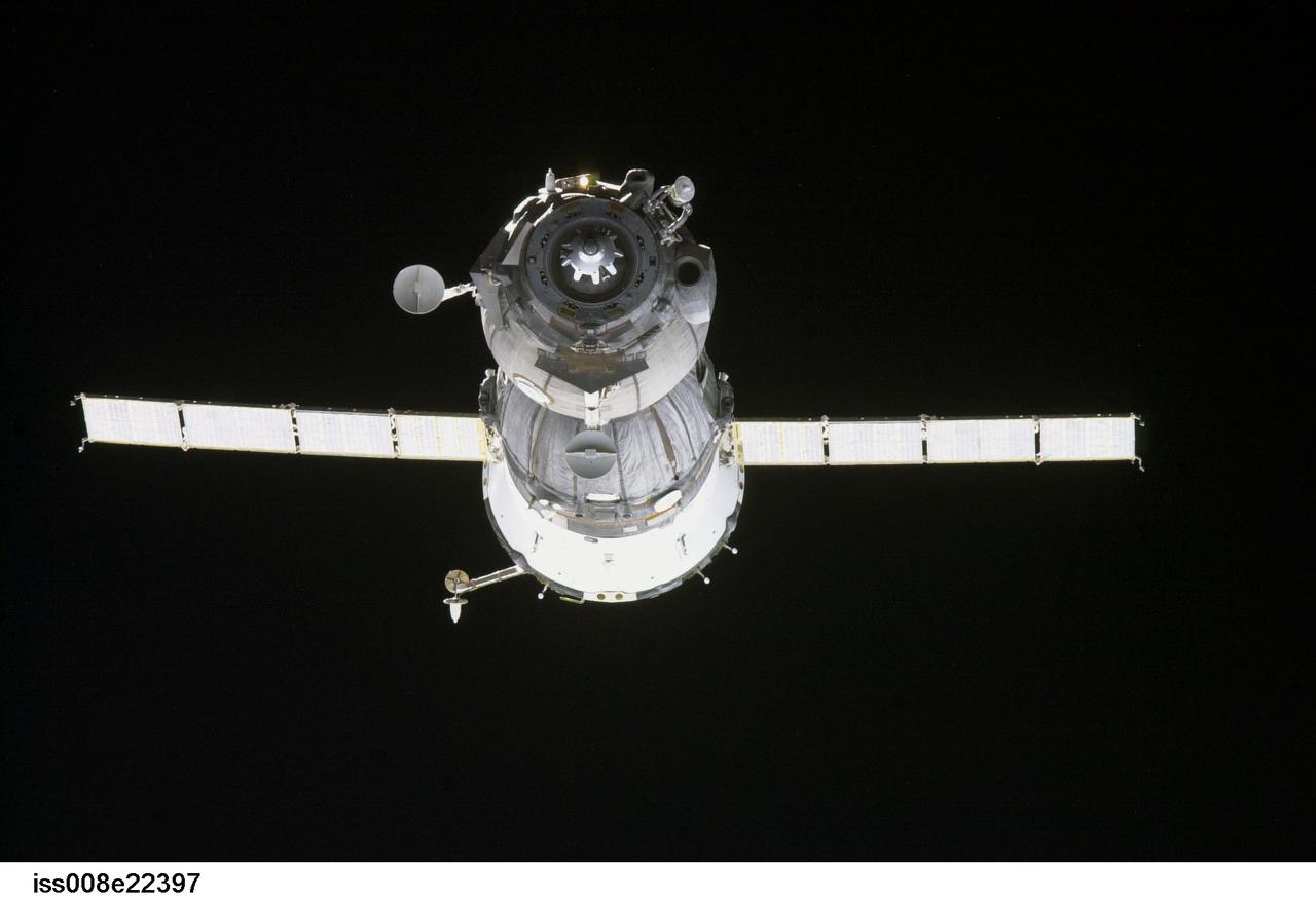 ISS008-E-22397 (21 April 2004) --- Backdropped by the blackness of space, the Soyuz TMA-4 spacecraft approaches the International Space Station (ISS). Onboard the spacecraft are cosmonaut Gennady I. Padalka, Expedition 9 commander representing Russia’s Federal Space Agency; astronaut Edward M. (Mike) Fincke, NASA ISS science officer and flight engineer; and European Space Agency (ESA) astronaut Andre Kuipers of the Netherlands. The Soyuz linked to the nadir docking port of the Zarya Control Module at 12:01 a.m. (CDT) on April 21, 2004 as the two spacecraft flew 230 miles above central Asia. The docking followed Monday’s launch from the Baikonur Cosmodrome in Kazakhstan.