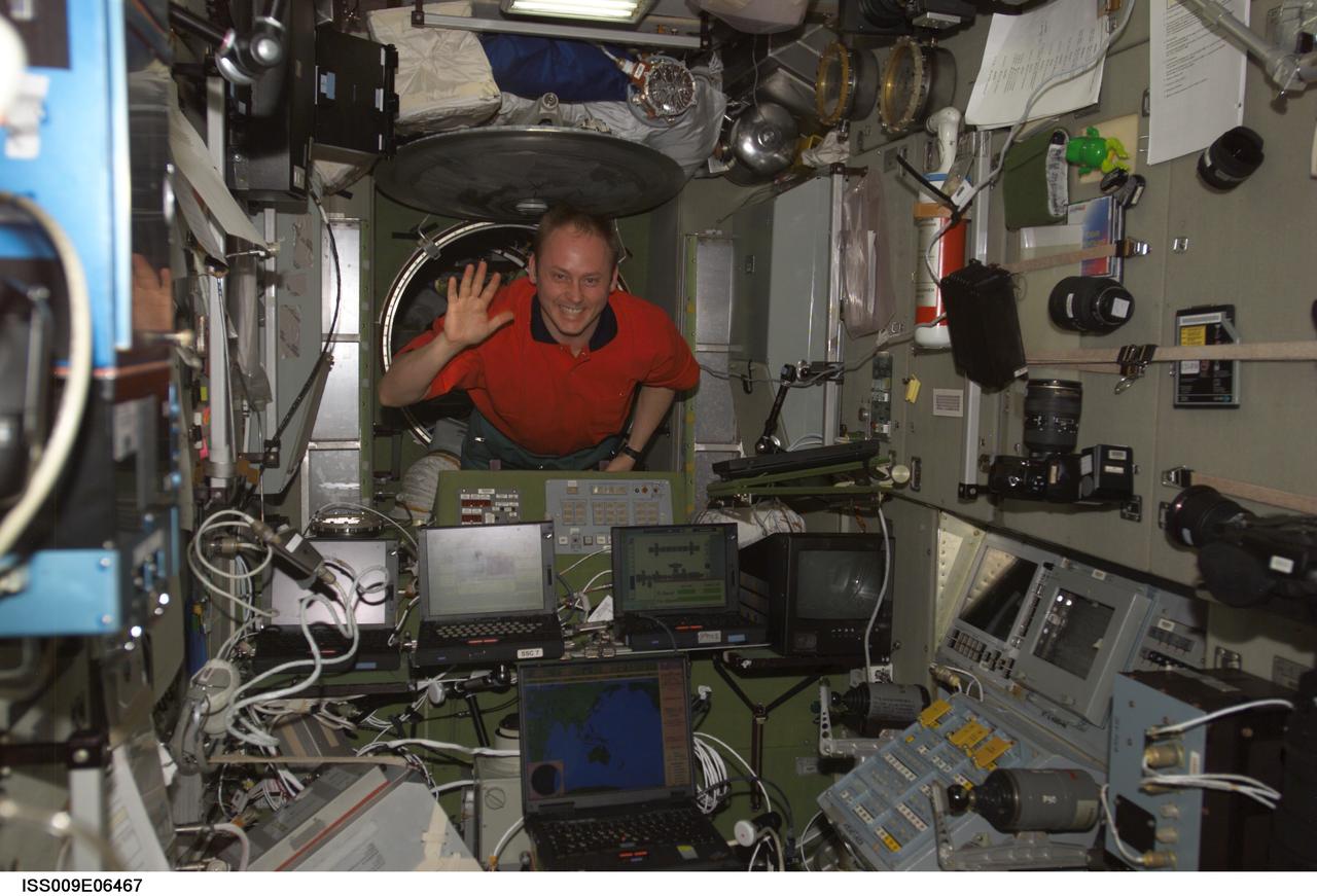 ISS009-E-06467 (11 May 2004) --- Astronaut Edward M. (Mike) Fincke, Expedition 9 NASA ISS science officer and flight engineer, floats in the Zvezda Service Module of the International Space Station (ISS).