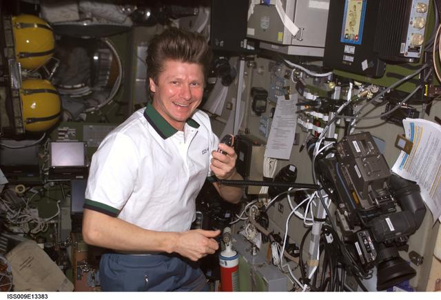 NASA image: Padalka talks on the ISS Ham radio in the SM during Expedition 9