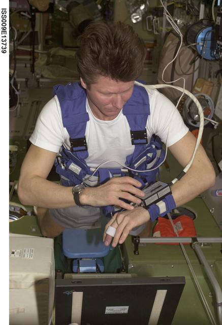 NASA image: Padalka collects medical data for the Cardiocog experiment onboard the SM during Expedition 9