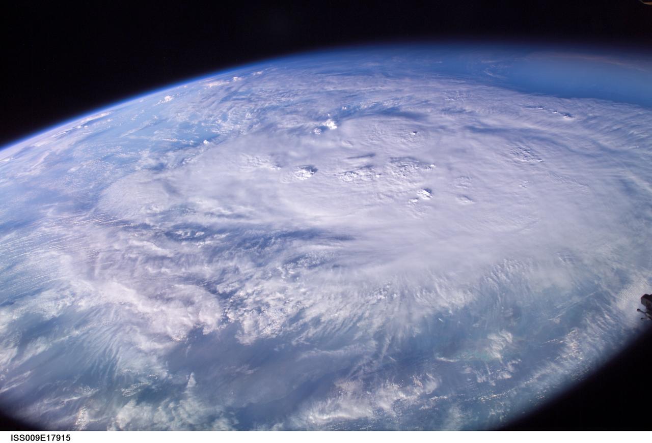ISS009-E-17915 (12 August 2004) --- This is an early morning view (6:29 a.m., CDT) from the International Space Station, which shows Hurricane Charley centered south of western Cuba over the Cayman Islands in the northwest Caribbean Sea. At the time of this image the storm was reported to be near 19.2N 80.5W with winds of 85 miles per hour as it moved northwest at 16 miles per hour. The north coast of Cuba is barely visible near the bottom of the image, which was taken by astronaut Mike Fincke looking to the south as the spacecraft flew on a track north of Cuba and the storm.