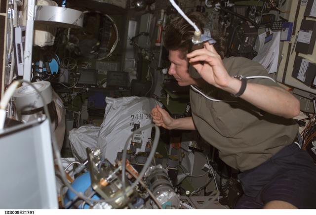 NASA image: Padalka performs maintenance on the BZh-5 Fluid Unit for the Elektron Oxygen Generator during Expedition 9