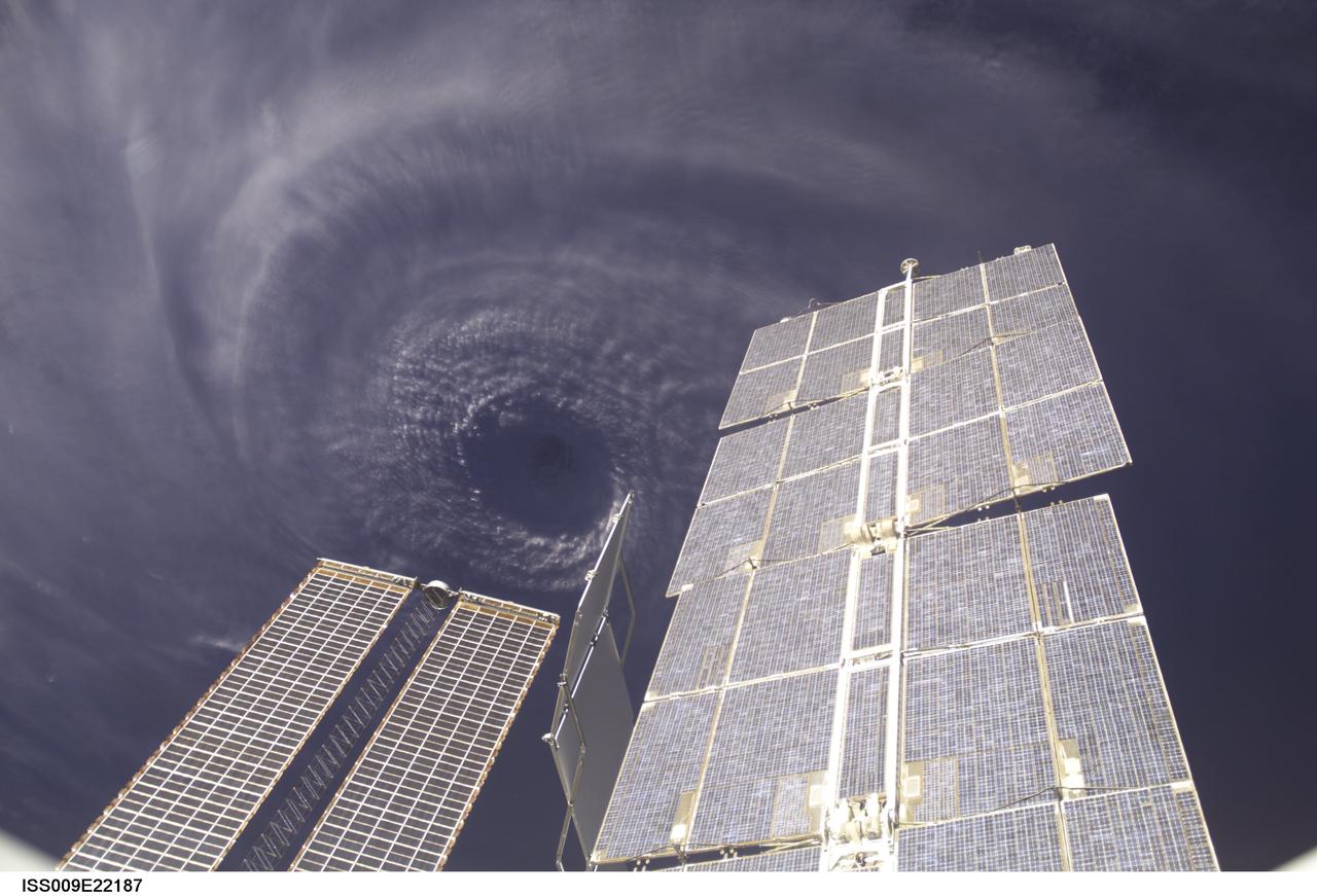 ISS009-E-22187 (11 September 2004) --- This image features the eye of Hurricane Ivan at center, partially framed by solar array panels on the International Space Station. One of the strongest hurricanes on record, Ivan was photographed Saturday from an altitude of about 230 miles by Astronaut Edward M. (Mike) Fincke, NASA ISS science officer and flight engineer, aboard the orbital outpost. At the time, Ivan was in the western Caribbean Sea and reported to have winds of 160 mph.