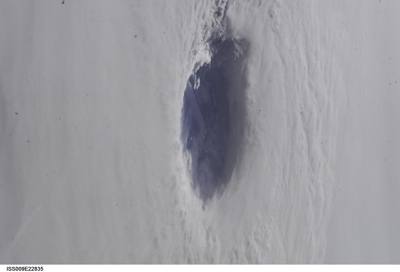 ISS009-E-22835 (15 September 2004) --- A look into the eye of the storm from space was provided by astronaut Edward M. (Mike) Fincke as Hurricane Ivan approached landfall on the central Gulf coast Wednesday afternoon (22:02:35 GMT, Sept. 15). At the time, sustained winds in the eye wall were reported at about 135 mph as the storm approached the Alabama coast. Fincke, the NASA ISS Science Officer, is nearing the end of a six-month stay on the orbiting complex with Commander Gennady Padalka. This photo was taken from an altitude of about 230 miles.