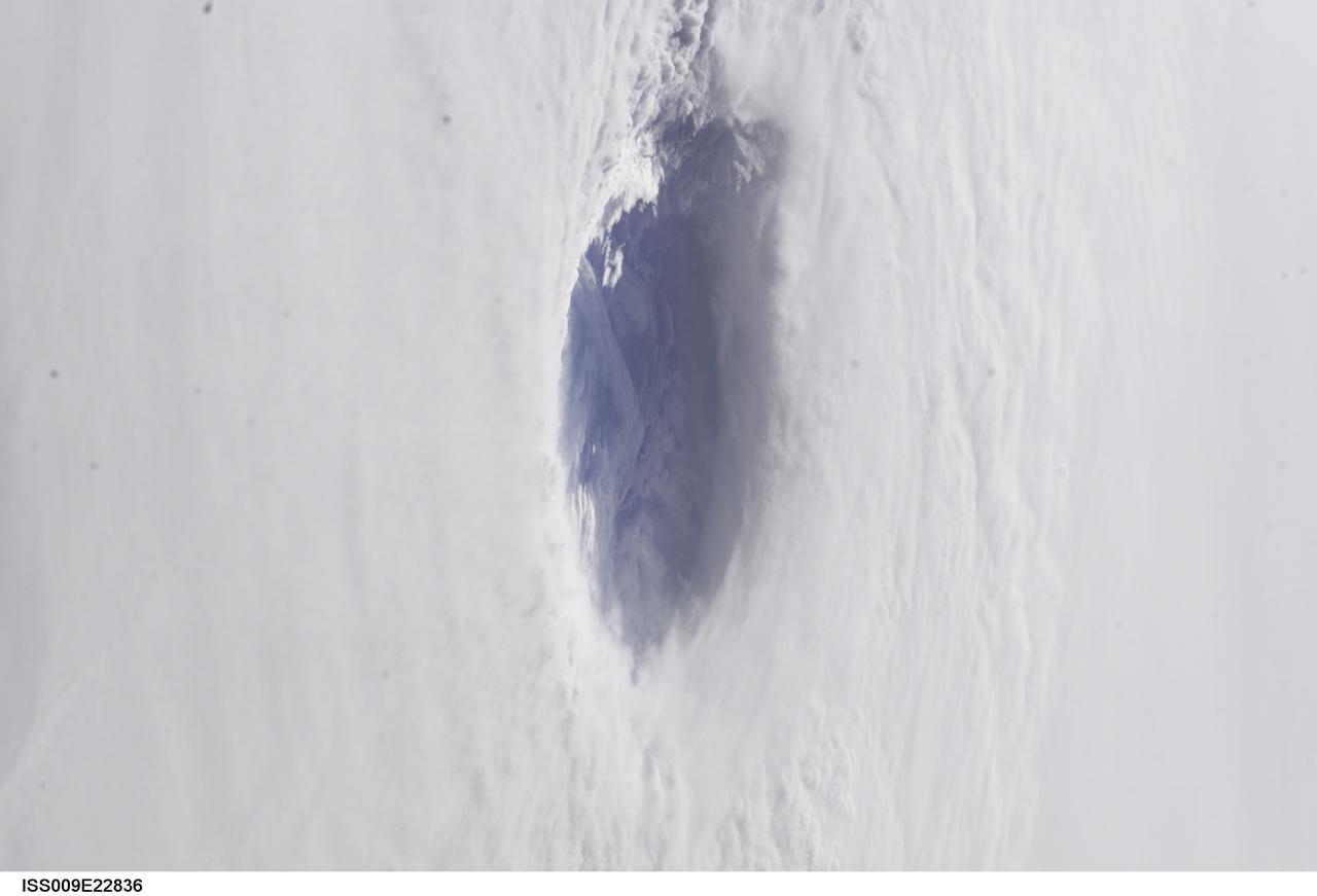 ISS009-E-22836 (15 September 2004) --- A look into the eye of the storm from space was provided by astronaut Edward M. (Mike) Fincke as Hurricane Ivan approached landfall on the central Gulf coast Wednesday afternoon (22:02:35 GMT, Sept. 15). At the time, sustained winds in the eye wall were reported at about 135 mph as the storm approached the Alabama coast. Fincke, the NASA ISS Science Officer, is nearing the end of a six-month stay on the orbiting complex with Commander Gennady Padalka. This photo was taken from an altitude of about 230 miles.