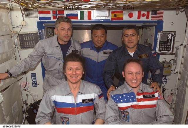 NASA image: Expedition 9 and 10 crewmembers pose for a crew photo during Exp. 9/10 joint operations
