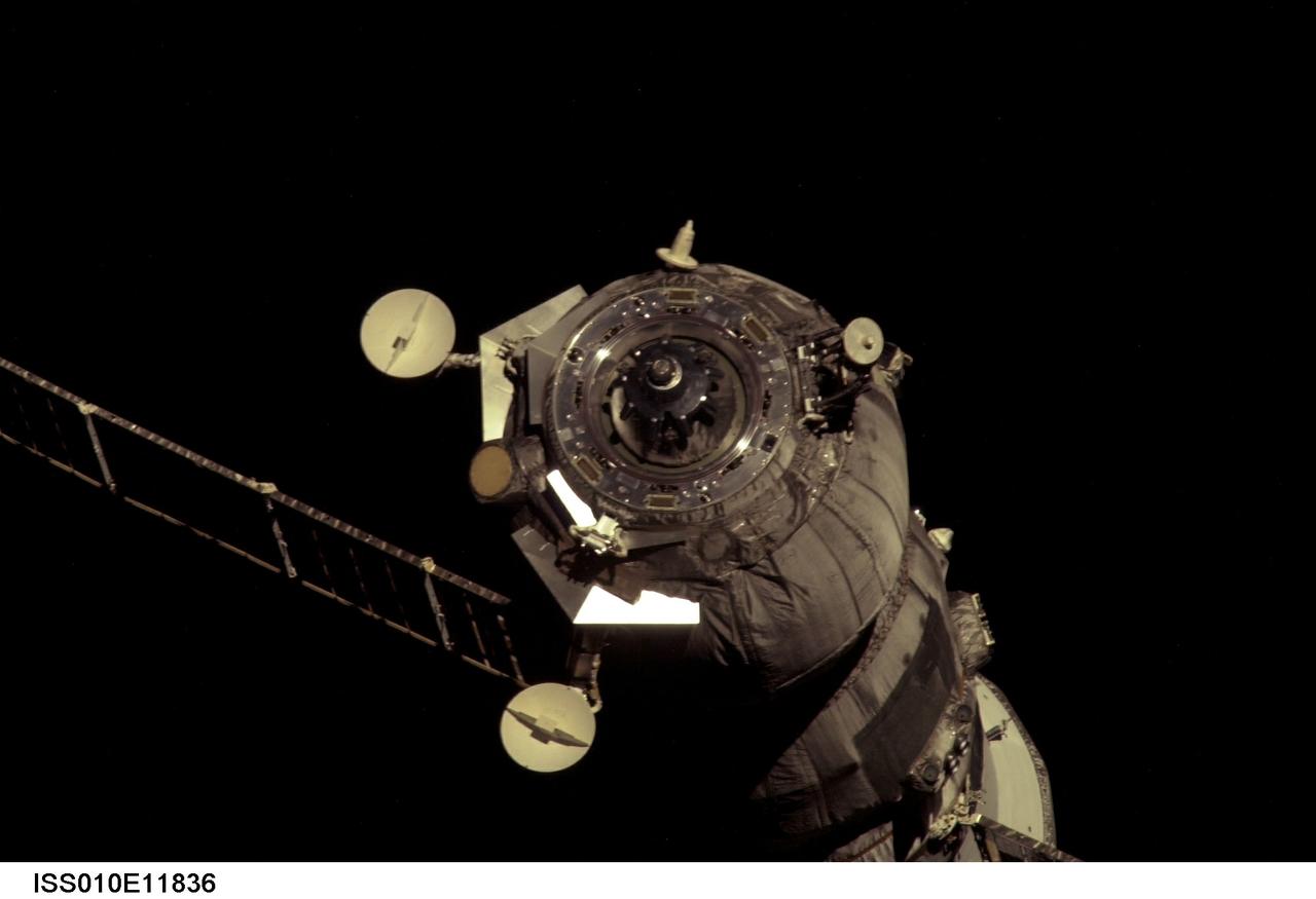 ISS010-E-11836 (22 December 2004) --- Backdropped by the blackness of space, an unpiloted Progress 15 supply vehicle undocks from the Zvezda Service Module of the International Space Station (ISS) at 1:37 pm (CST) on December 22, 2004, carrying its load of trash and unneeded equipment to be deorbited and burned up in Earths atmosphere. The undocking clears the way for the arrival of a new Progress 16, planned to launch December 23 and dock with the Station on December 25.