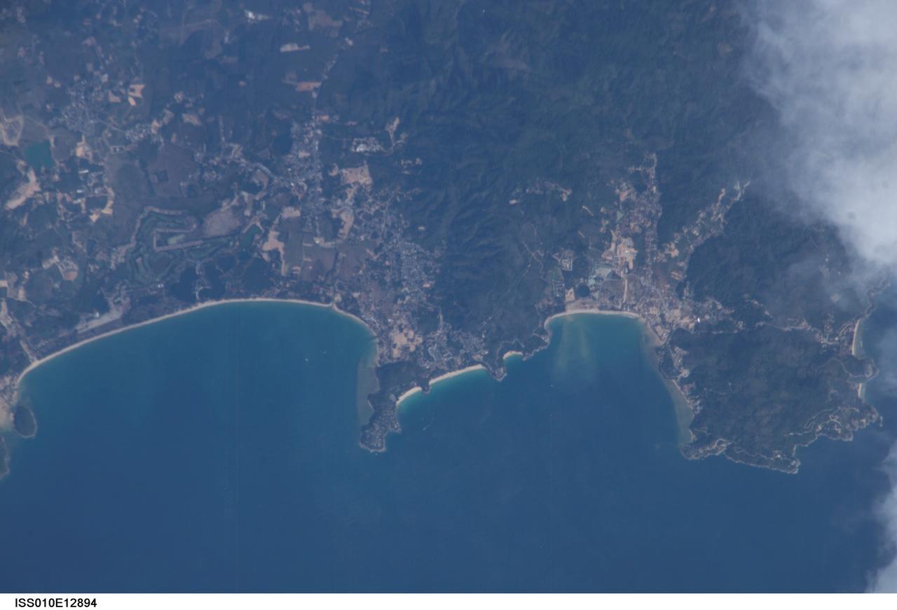 ISS010E12894 (13 January 2005) --- One of a series of post-tsunami digital still images which were photographed from the International Space Station on January 13, 2005. This image showing part of Thailand is centered at 7.96 degrees north latitude and 98.27 degrees east longitude near Phuket. According to NASA scientists studying the ISS imagery, the image shows some damage around the bays and low lying areas adjacent to the bays.
