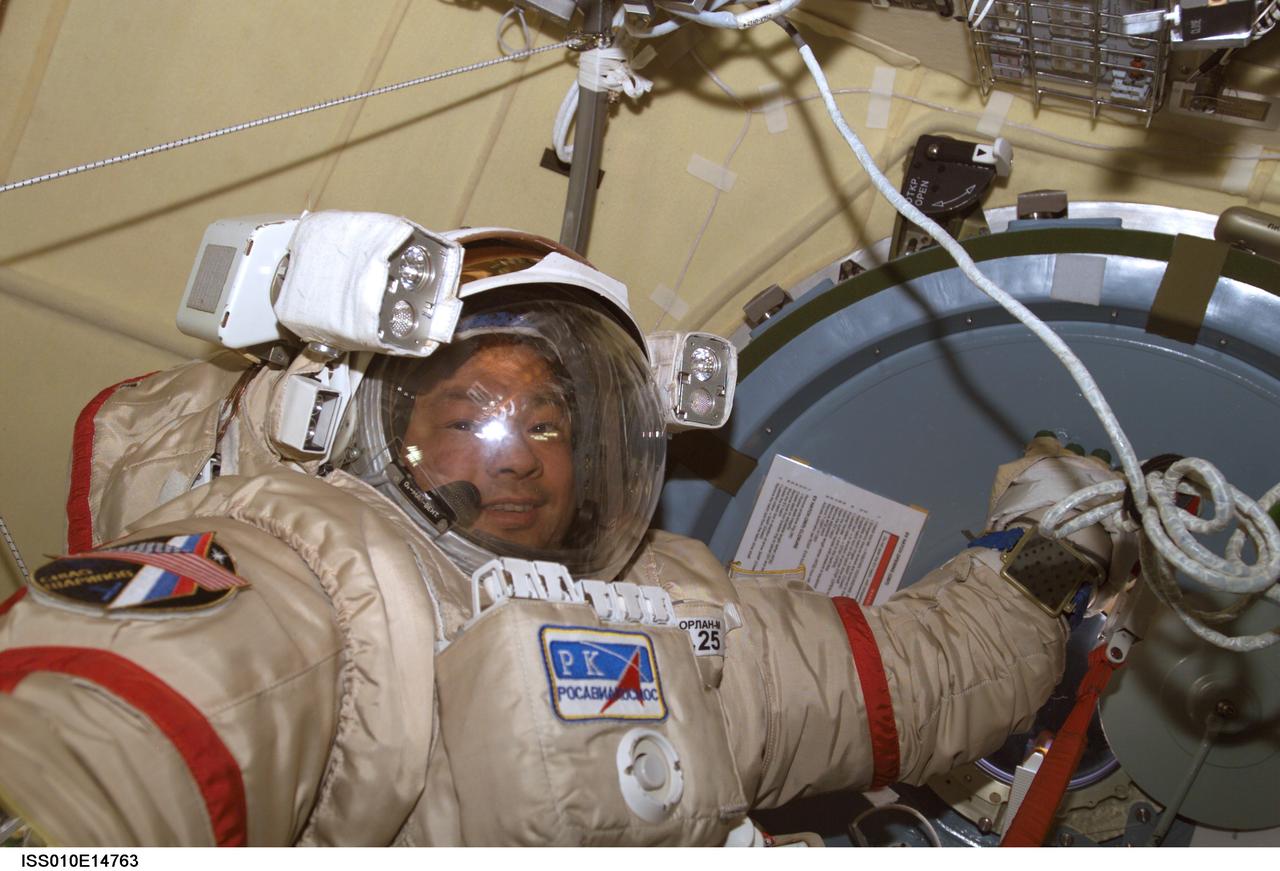 ISS010-E-14763 (24 January 2005) --- Astronaut Leroy Chiao, Expedition 10 commander and NASA ISS science officer, attired in his Russian Orlan spacesuit, participates in extravehicular activity (EVA) preparations in the Pirs Docking Compartment of the International Space Station (ISS). The spacewalk is scheduled for January 26.