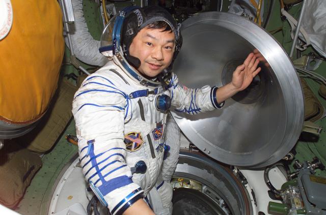 NASA image: Chiao wearing Sokol suit in the Transfer Compartment of the SM taken during Expedition 10