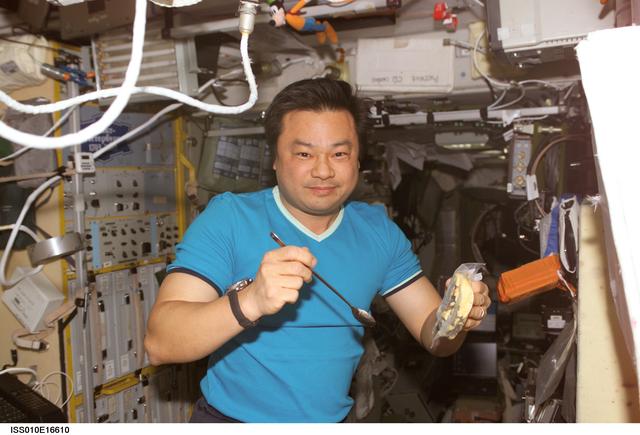 NASA image: Chiao eats meal in the SM taken during Expedition 10