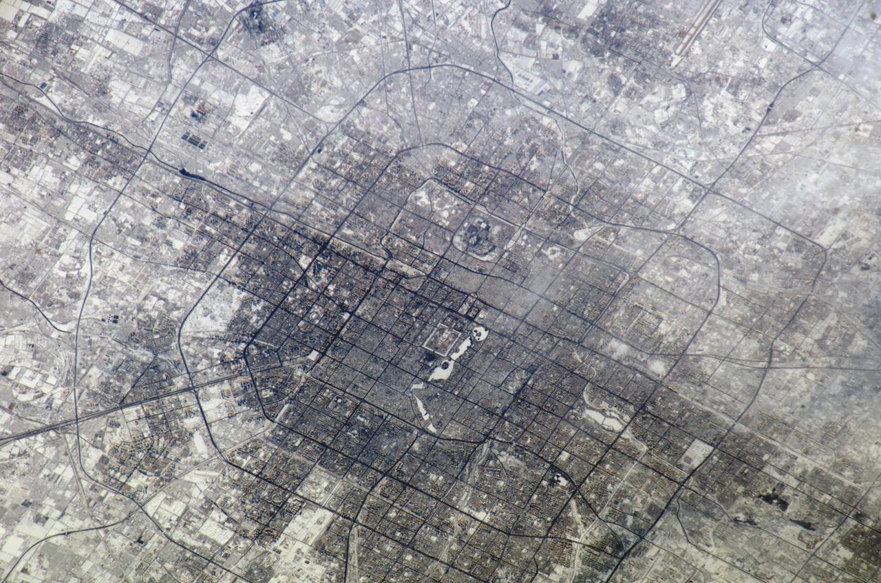 ISS010-E-18196 (18 February 2005) --- The large city Beijing (Peking), China is featured in this image photographed by an Expedition 10 crewmember on the International Space Station.