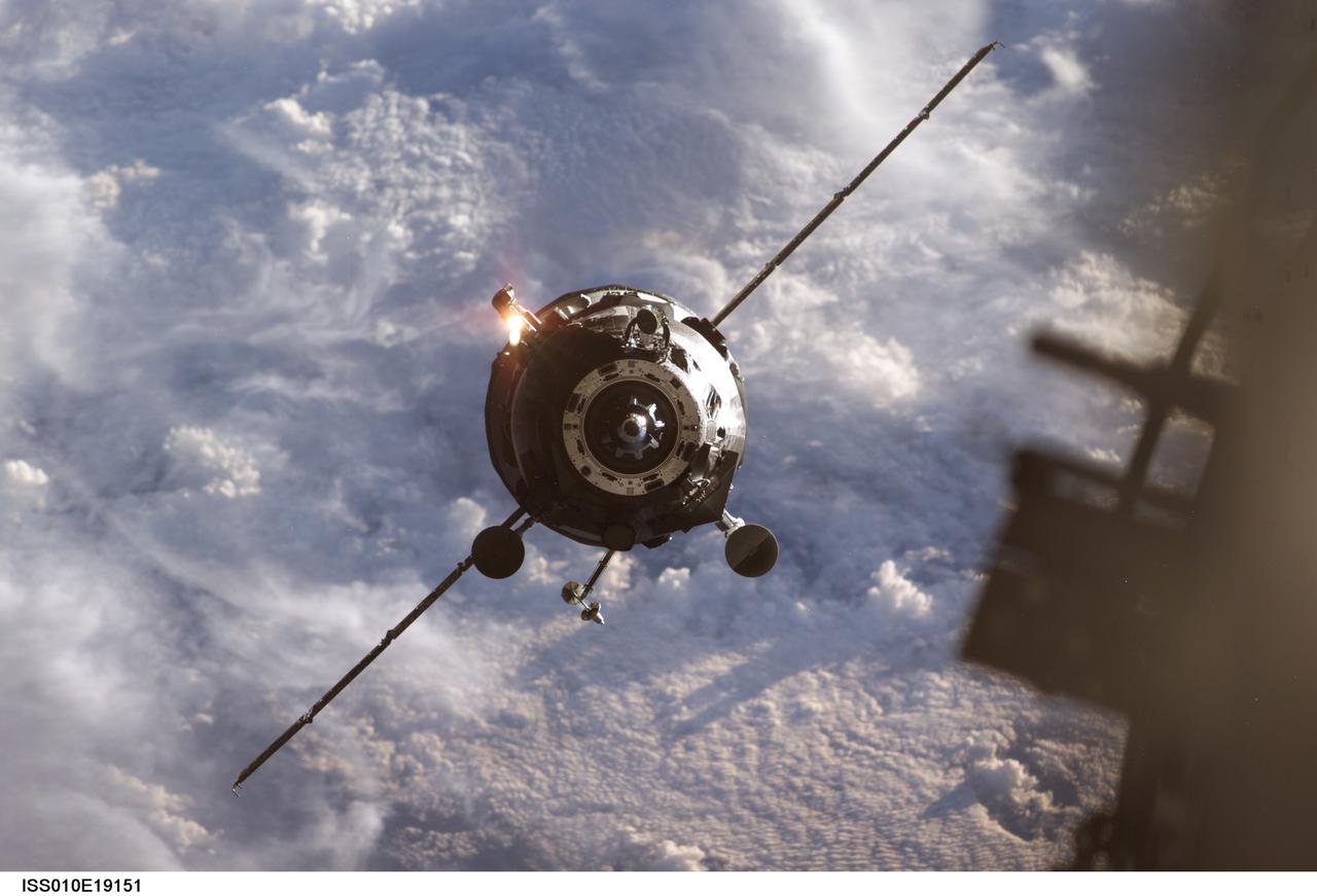 ISS010-E-19151 (2 March 2005) --- Backdropped by a blanket of clouds, an unpiloted Progress supply vehicle approaches the International Space Station (ISS). The Progress 17 resupply craft launched at 1:09 p.m. (CST) on February 28, 2005 from the Baikonur Cosmodrome in Kazakhstan to deliver two tons of supplies, food, water, fuel and equipment to the Expedition 10 crewmembers onboard the Station. Progress docked to the aft port of the Zvezda Service Module at 2:10 p.m. (CST) on March 2 as the Station flew 225 statute miles over the equator west of Africa.