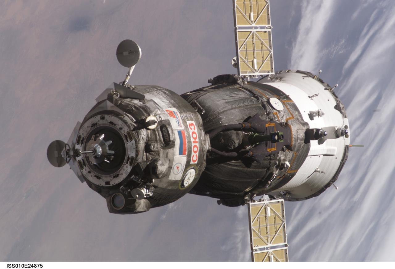 ISS010-E-24875 (16 April 2005) --- Backdropped by a blue and white Earth, this close-up view features the Soyuz TMA-6 spacecraft approaching the International Space Station (ISS). Onboard the spacecraft are cosmonaut Sergei K. Krikalev, Expedition 11 commander representing Russia's Federal Space Agency; astronaut John L. Phillips, NASA ISS science officer and flight engineer; and European Space Agency (ESA) astronaut Roberto Vittori of Italy. The Soyuz linked to the Pirs Docking Compartment at 9:20 p.m. (CDT) on April 16, 2005 as the two spacecraft flew over eastern Asia. The docking followed Friday’s launch from the Baikonur Cosmodrome in Kazakhstan.