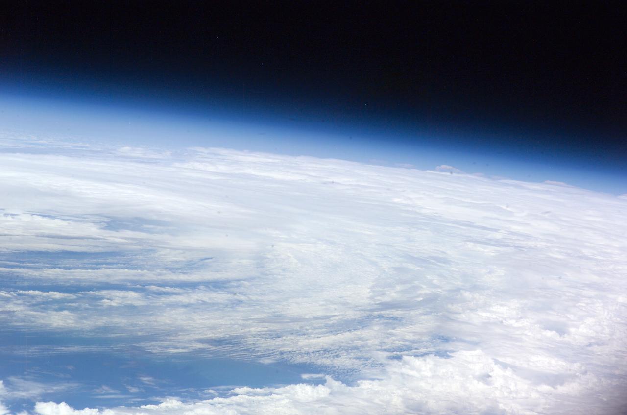 ISS011-E-08483 (11 June 2005)  --- From 225 miles above Earth, the crew members aboard the International Space Station captured early  tropical activity of the 2005 season, using an Electronic Still Camera.  At the time of this photo (17:27:32 GMT, June 11, 2005), tropical storm Arlene was about two hours away from making landfall near Gulf Shores, AL with 60 mph winds. This frame and ISS011-E-08482 together encompass the entire body of the disorganized storm.  View is from the southeast over the central Bahamas.