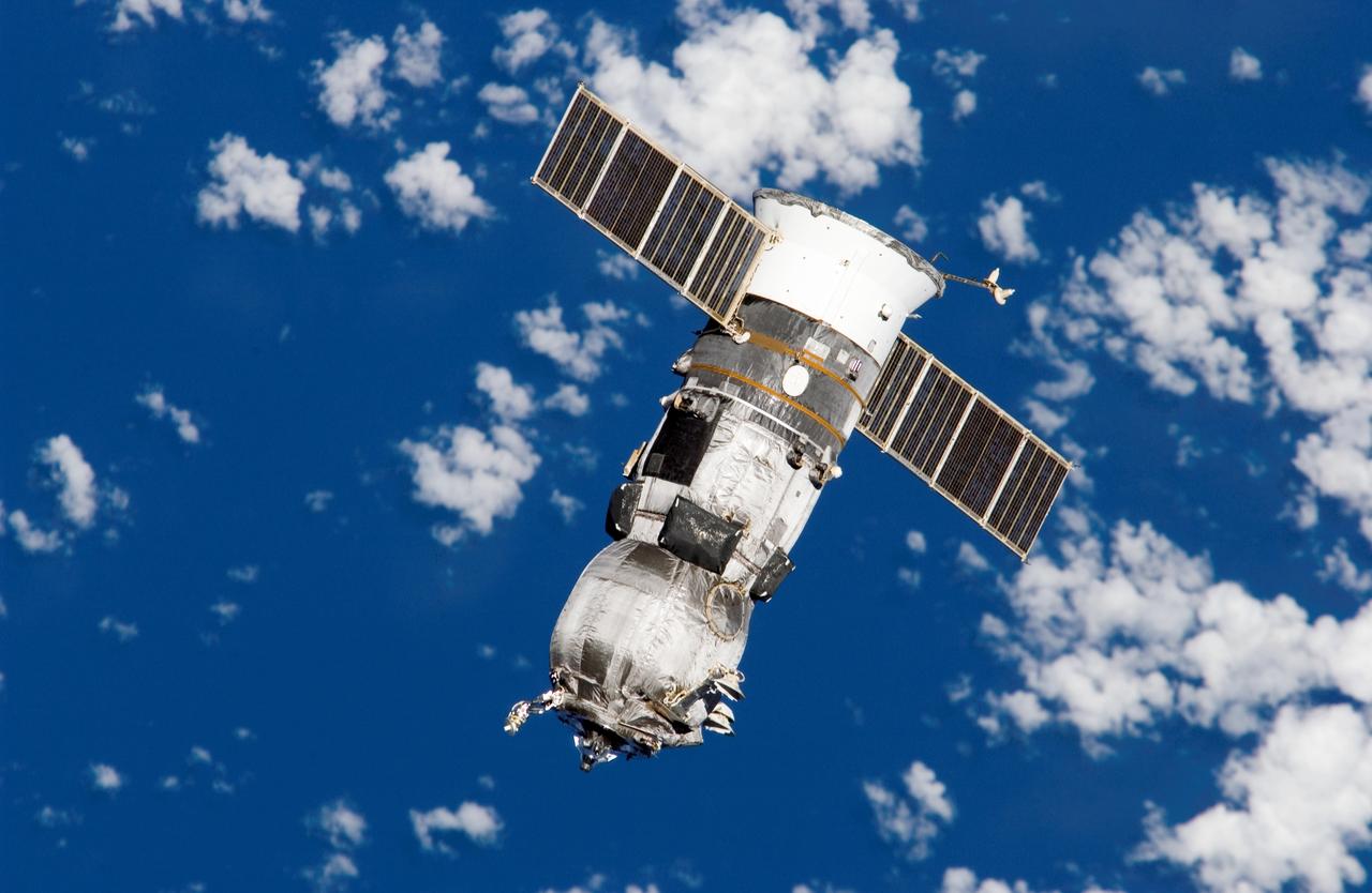 ISS011-E-08855 (15 June 2005) --- Backdropped by a blue and white Earth, an unpiloted Progress 17 supply vehicle departs from the international space station at 3:16 p.m. (CDT) on June 15, 2005, carrying its load of trash and unneeded equipment to be deorbited and burned up in Earth’s atmosphere. The undocking clears the way for the arrival of a new Progress 18, planned to launch June 16 and dock with the station on June 18.