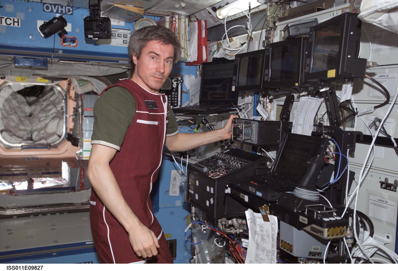 ISS011-E-09827 (29 June 2005) --- Cosmonaut Sergei K. Krikalev, Expedition 11 commander representing Russia's Federal Space Agency, works with the Canadarm2 and the Mobile Service System (MSS) in the Destiny laboratory of the International Space Station.