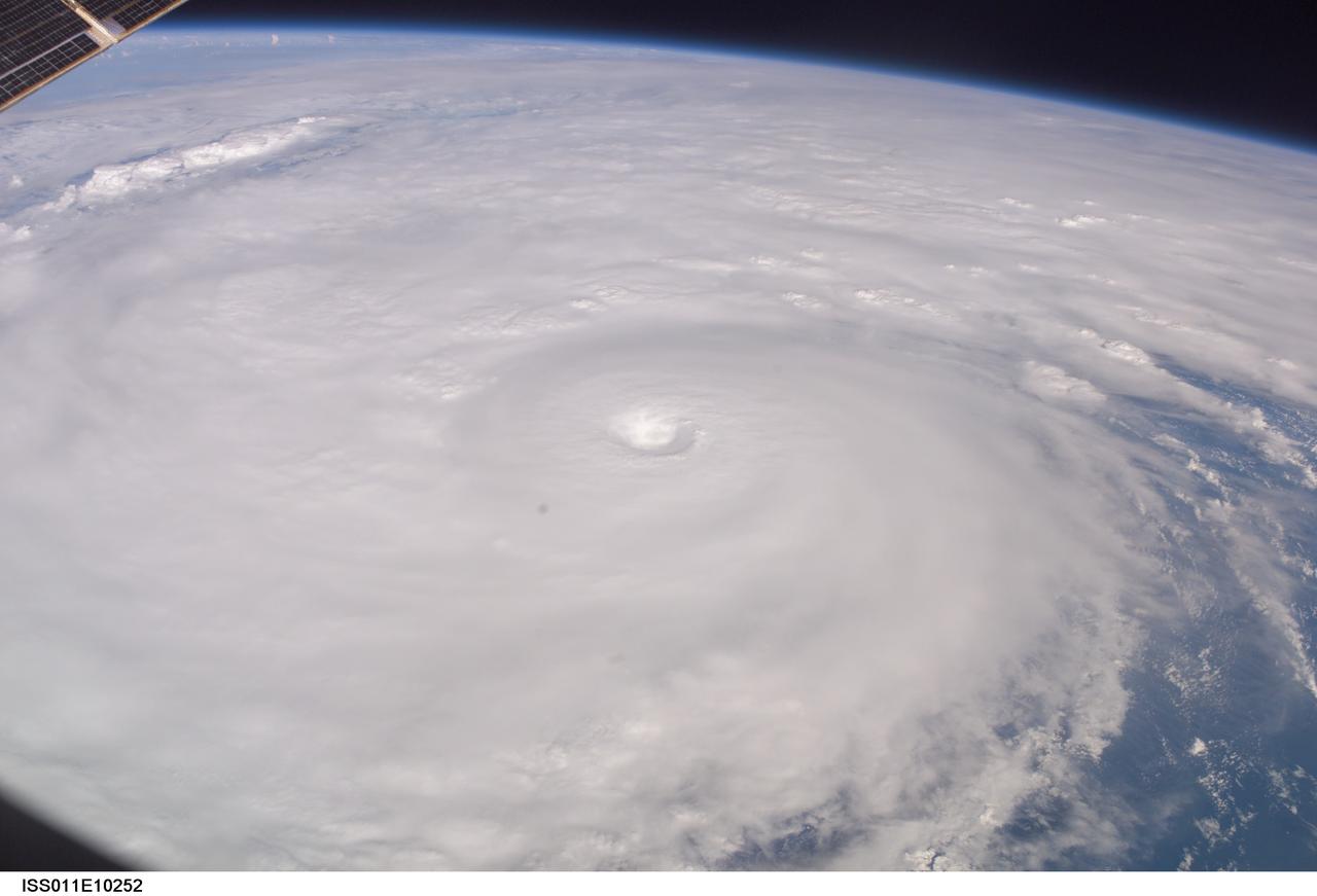 ISS011-E-10252 (9 July 2005) --- This easterly-looking image from the International Space Station shows Hurricane Dennis after the storm had already crossed Cuba and was heading for the northern Gulf of Mexico. Dennis was a Category 3 storm, packing winds of 115 miles per hour, at the time of exposure and located approximately 385 miles southeast of Biloxi, Mississippi or 280 miles south of Panama City, Florida. The image was exposed at 22:06:35 (GMT), July 9, 2005.  The storm's eye is at frame center. The black triangle in extreme lower left is part of the Space Station's window.