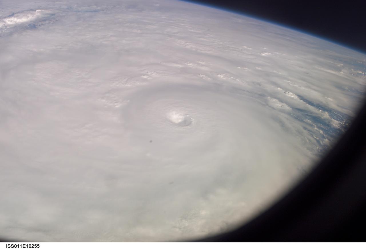 ISS011-E-10255 (9 July 2005)  --- This easterly-looking image from the International Space Station shows Hurricane Dennis after the storm had already crossed Cuba and was heading for the northern Gulf of Mexico. Dennis was a Category 3 storm, packing winds of 115 miles per hour, at the time of exposure and located approximately 385 miles southeast of Biloxi, Mississippi or 280 miles south of Panama City, Florida.  The eye of the hurricane is in the center of the frame, exposed at 22:06:54 (GMT), July 9, 2005. The dark triangle in loer right corner is part of the Space Station's window.