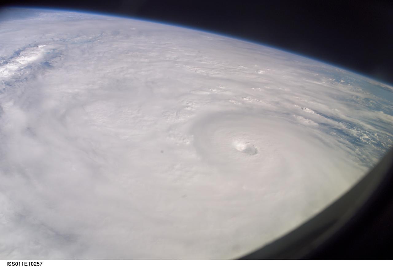 ISS011-E-10257 (9 July 2005) --- This easterly-looking image from the International Space Station shows Hurricane Dennis after the storm had already crossed Cuba and was heading for the northern Gulf of Mexico. Dennis was a Category 3 storm, packing winds of 115 miles per hour, at the time of exposure and located approximately 385 miles southeast of Biloxi, Mississippi or 280 miles south of Panama City, Florida. The image was exposed at 22:07:26 (GMT), July 9, 2005.  The storm's eye is just to the right of frame center. The black triangle in extreme lower right is part of the Space Station's window.