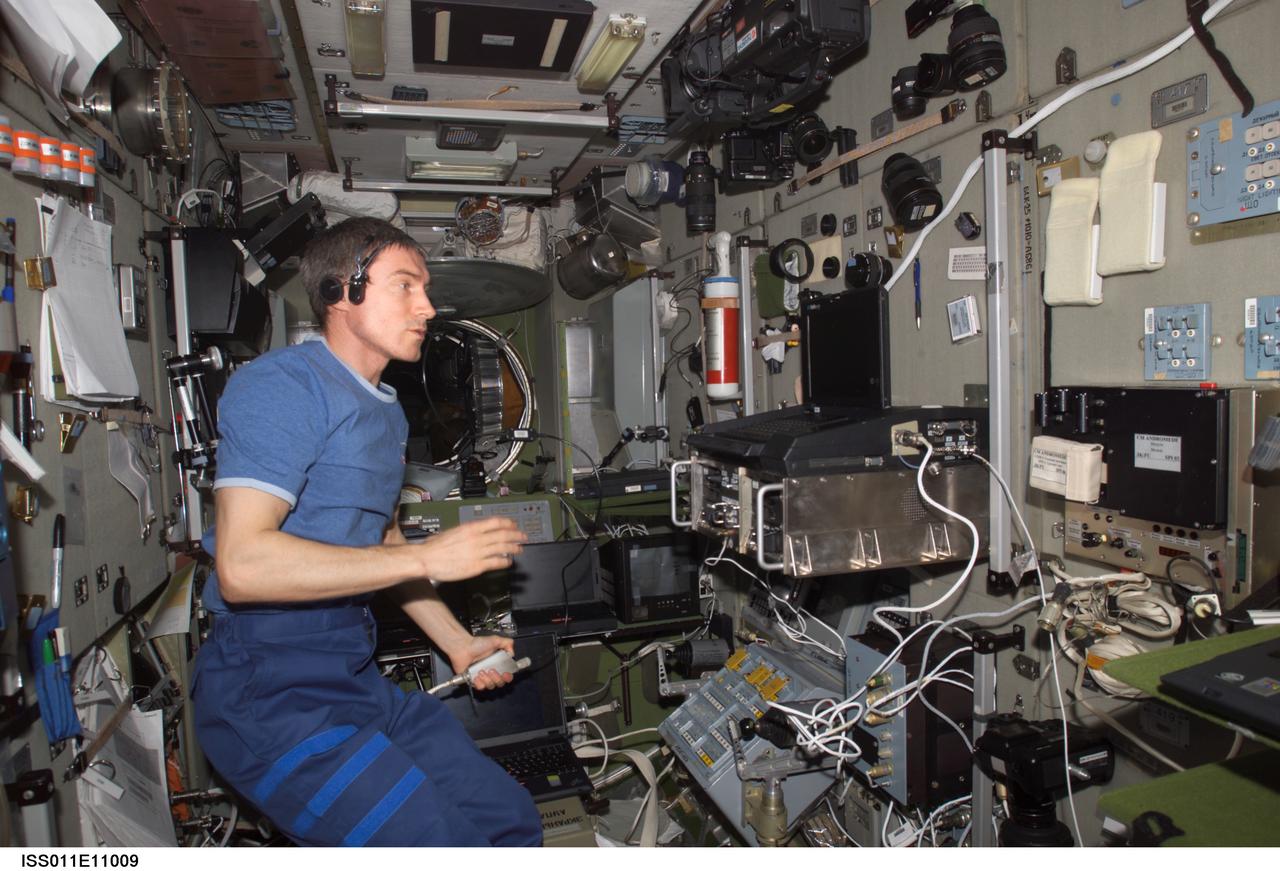 ISS011-E-11009 (28 July 2005) --- Cosmonaut Sergei Krikalev of Russia's Federal Space Agency, Expedition 11 commander onboard the International Space Station (ISS), communicates with the crew onboard the soon to be approaching Space Shuttle.