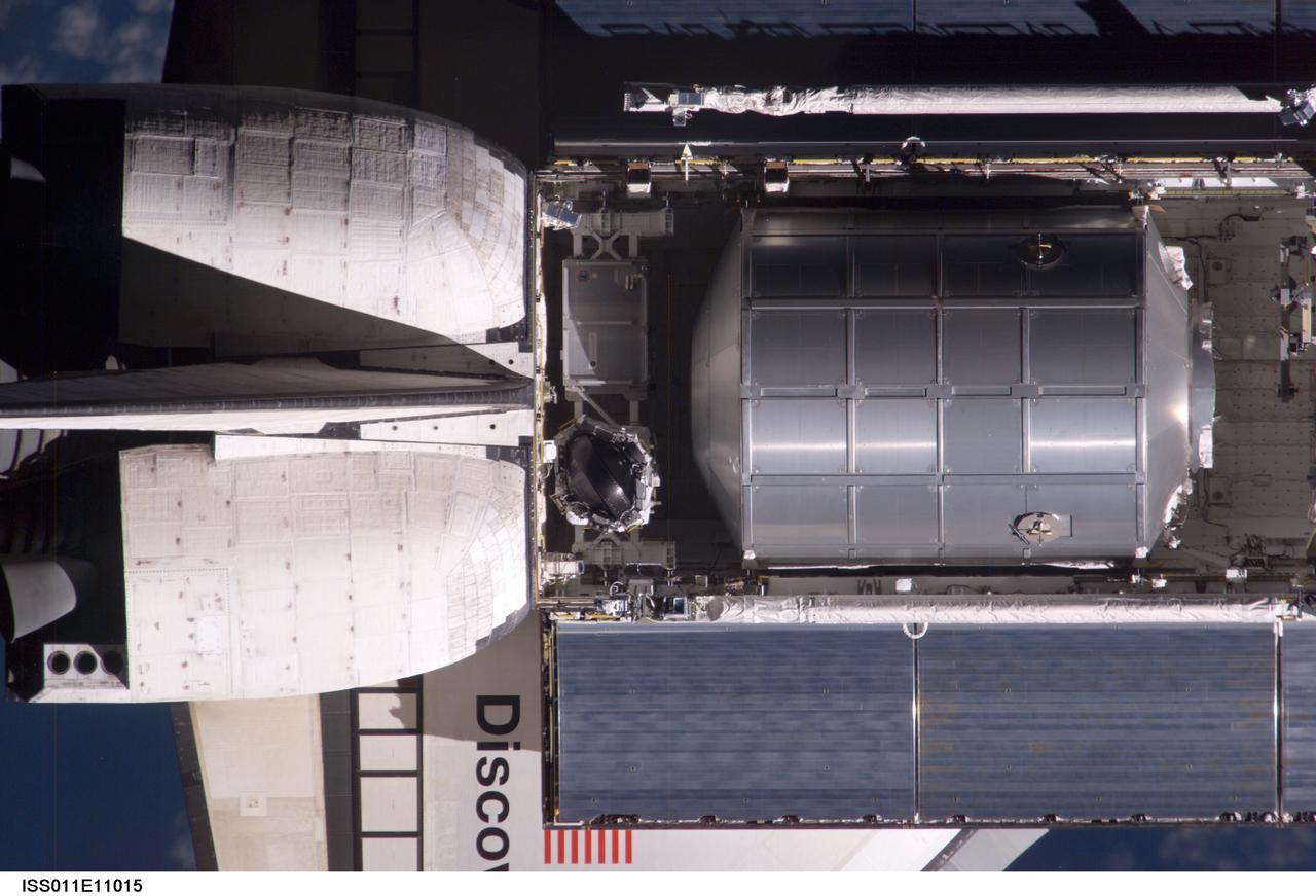 ISS011-E-11015 (28 July 2005) --- The Space Shuttle Discovery's cargo bay and Multipurpose Logistics Module (MPLM) payload as seen from the International Space Station (ISS) just prior to docking earlier today.