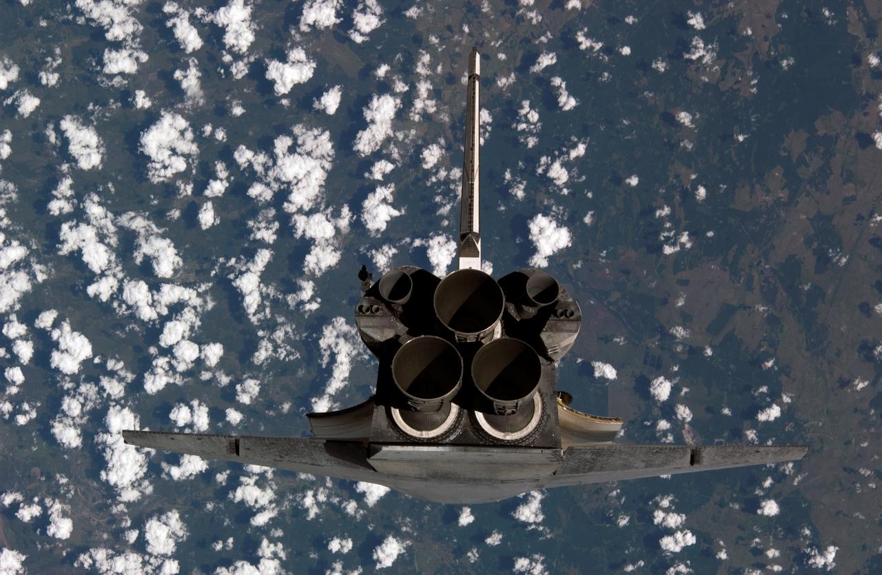 ISS011-E-11269 (28 July 2005) --- Space Shuttle Discovery was about 600 feet from the International Space Station when cosmonaut Sergei K. Krikalev, Expedition 11 commander, and astronaut John L. Phillips, NASA Space Station science officer and flight engineer, photographed the spacecraft as it approached the Station and performed a backflip to allow photography of its heat shield. Astronaut Eileen M. Collins, STS-114 commander, guided the Shuttle through the flip. The photos will be analyzed by engineers on the ground as additional data to evaluate the condition of Discovery;s heat shield.