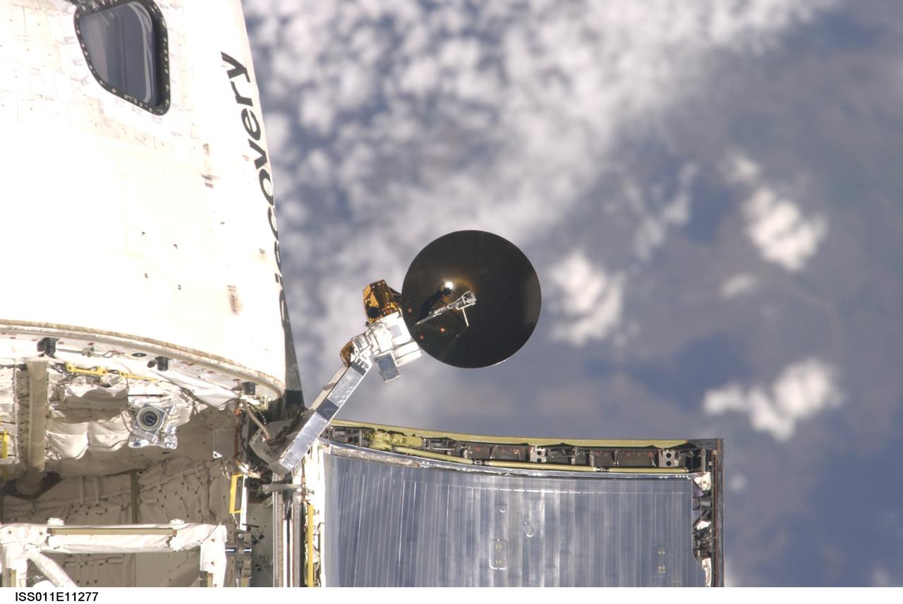 ISS011-E-11277 (28 July 2005) --- View of the Space Shuttle Discovery's Ku-band antenna photographed during the mapping sequence by the Expedition 11 crew on the International Space Station during the STS-114 R-Bar Pitch Maneuver on Flight Day 3.