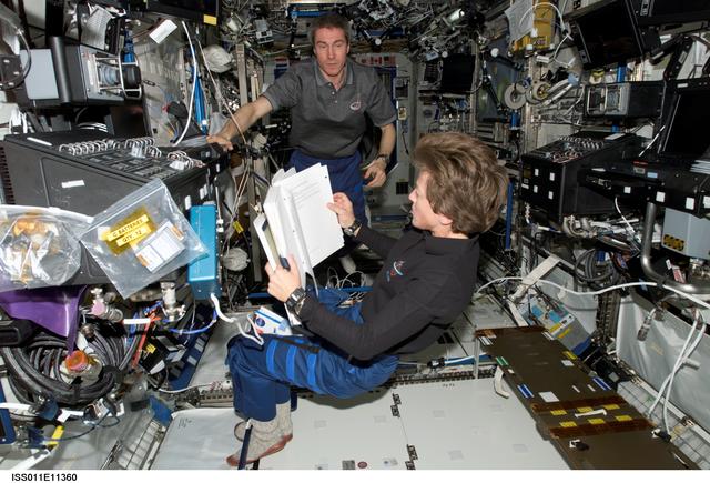 NASA image: Lawrence and Krikalev in Destiny laboratory module during transfer operations.