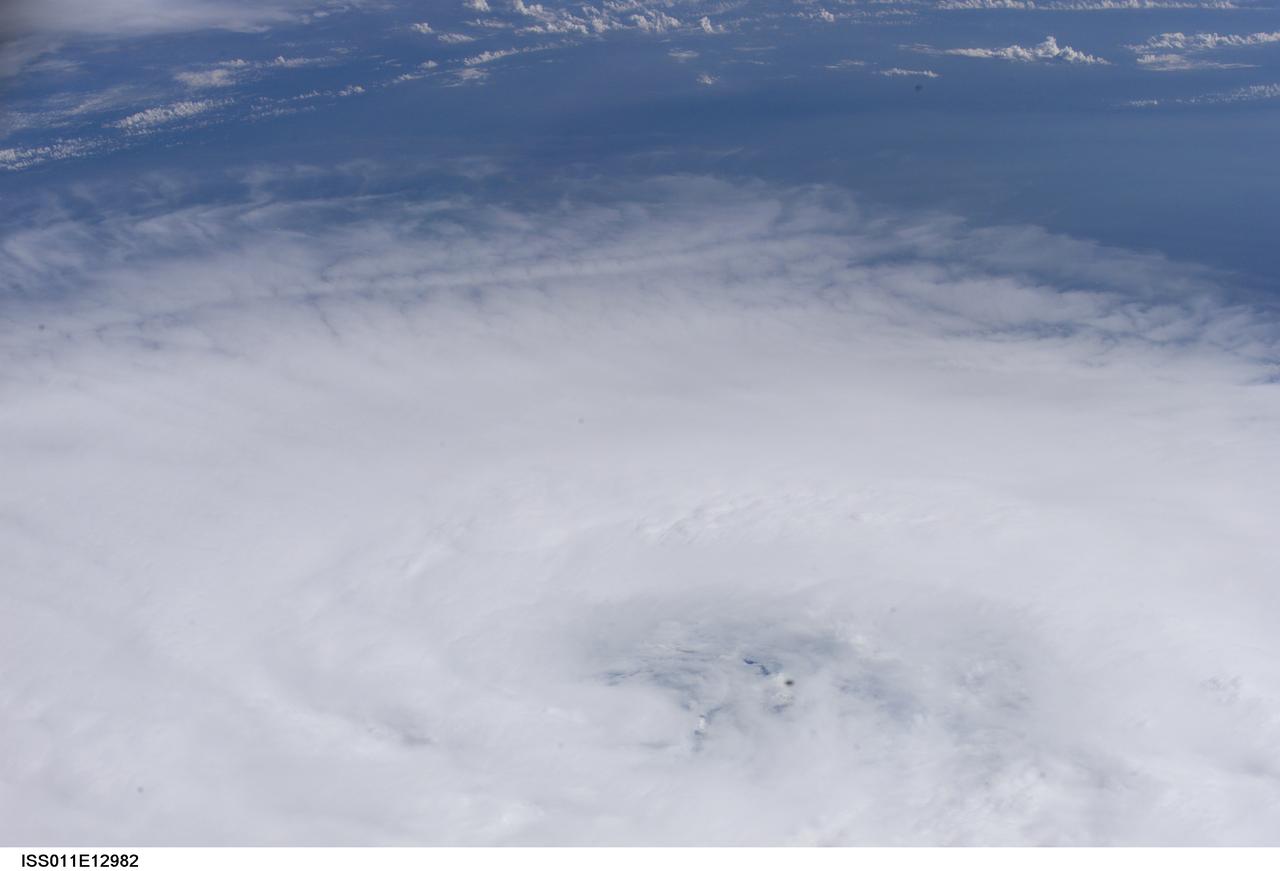 ISS011-E-12982 (14 September 2005, 19:14:09 GMT) --- This high oblique view of Hurricane Ophelia was taken on the afternoon of September 14 from the International Space Station. The ill-defined eye is located at bottom center of the frame. The slow-moving storm is off the coast of the Carolinas.