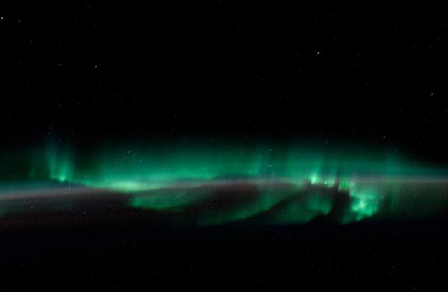 ISS011-E-14205 (May 2005) --- This view featuring the Aurora Australis or “southern lights” was photographed by an Expedition 11 crewmember aboard the International Space Station.