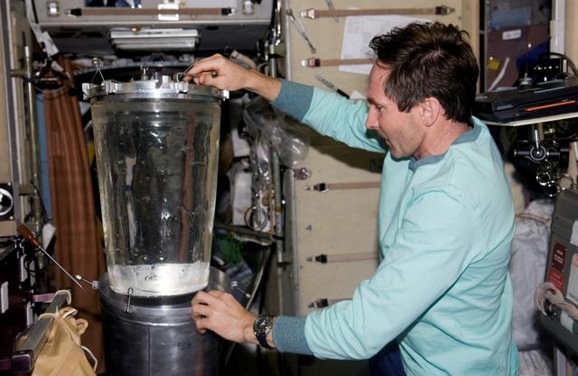 NASA image: Tokarev conducts a water transfer from the Progress 19 Tanks during Expedition 12