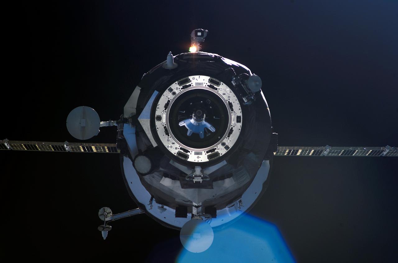 ISS012-E-13564 (23 Dec. 2005) --- Backdropped by the blackness of space, an unpiloted Progress supply vehicle approaches the International Space Station. The Progress 20 resupply craft launched at 12:38 p.m. (CST) on Dec. 21, 2005 from the Baikonur Cosmodrome in Kazakhstan to deliver 2.8 tons of supplies, gifts, food, water, fuel and equipment to the Expedition 12 crew members onboard the station. Progress docked to the Pirs Docking Compartment at 1:46 p.m. (CST) on Dec. 23 as the station flew approximately 220 statute miles above the Atlantic off the east coast of South America.