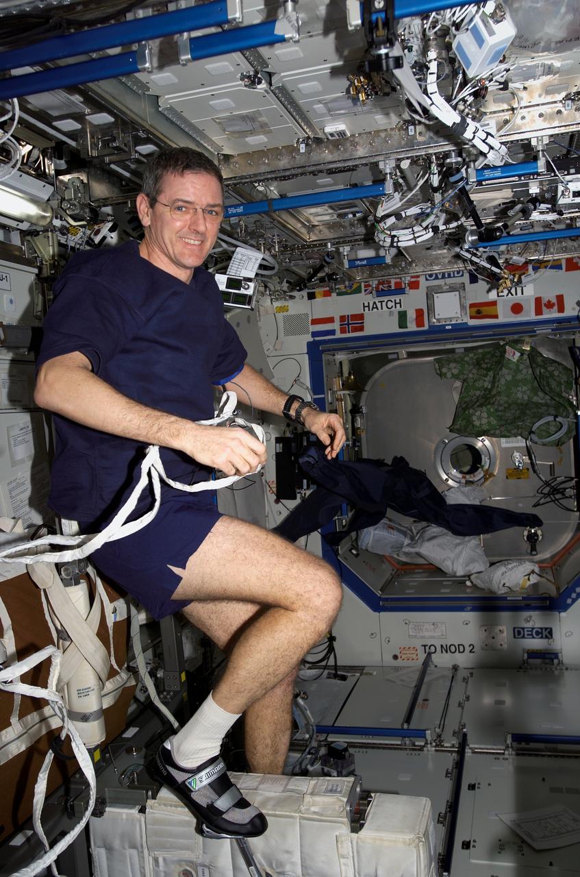 ISS012-E-14206 (3 Jan. 2006) --- Astronaut William S. (Bill) McArthur Jr., Expedition 13 commander and NASA space station science officer, exercises on the Cycle Ergometer with Vibration Isolation System (CEVIS) in the Destiny laboratory of the International Space Station.
