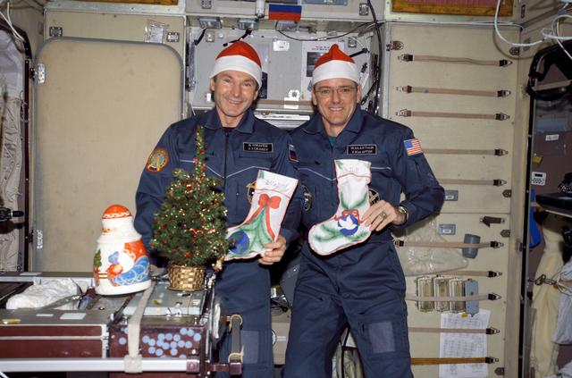 NASA image: McArthur and Tokarev celebrate New Year with Grandfather Frost during Expedition 12
