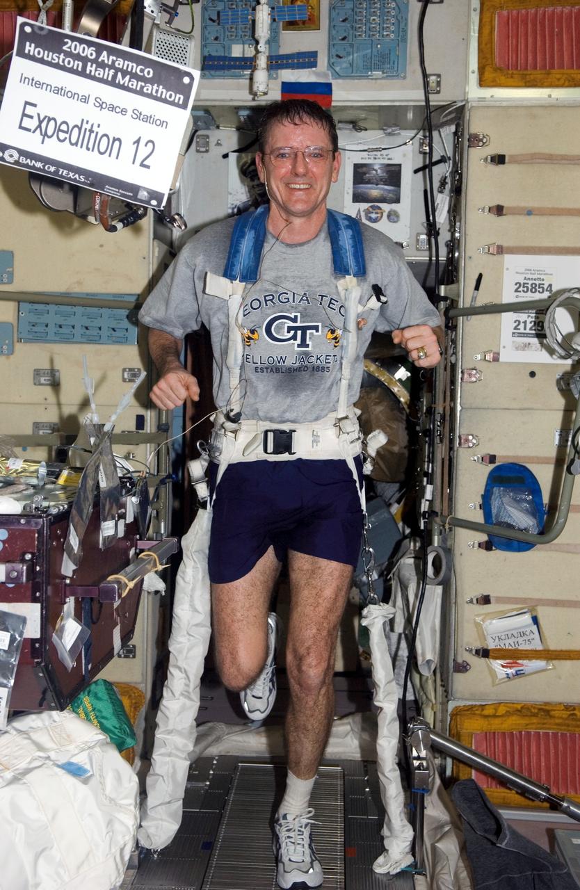 ISS012-E-15158 (15 Jan. 2006) --- Astronaut William S. (Bill) McArthur, Jr., Expedition 12 commander and NASA space station science officer, exercises on the Treadmill Vibration Isolation System (TVIS) in the Zvezda Service Module of the International Space Station.